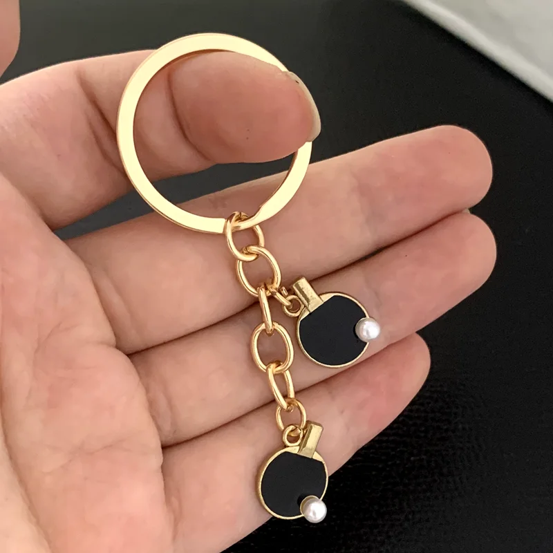 Black Red sports table tennis  - Table Tennis Keychain recension och pris